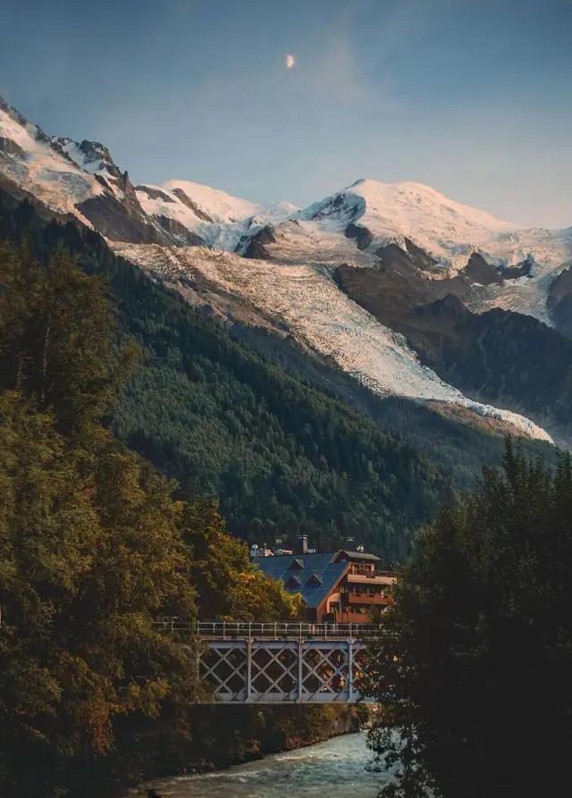 The Bossons glacier and Mont Blanc above the Arve river in Chamonix