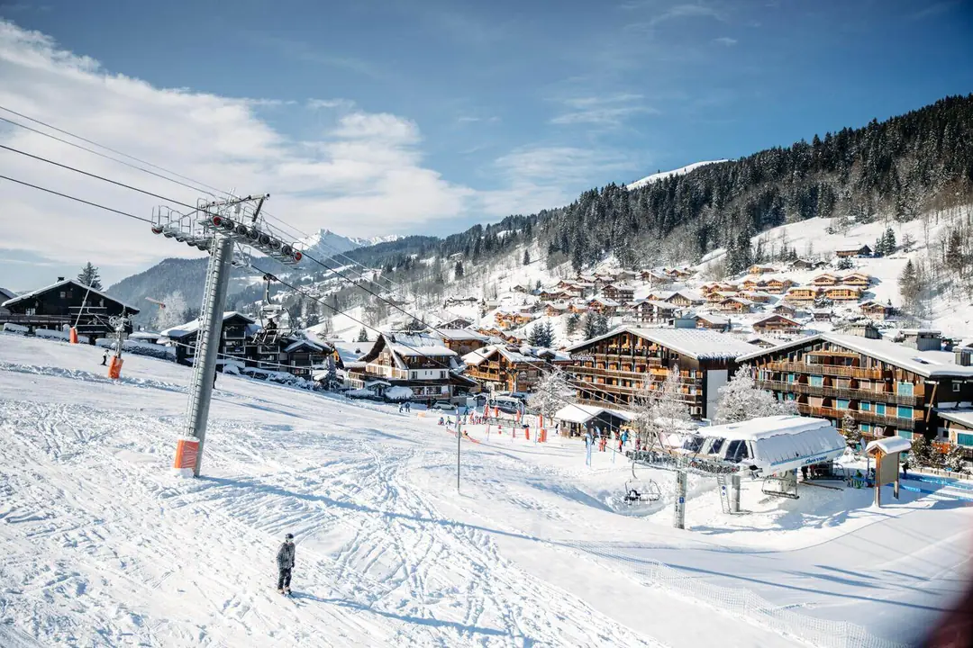Chairlift and ski-in chalets in the village of Les Gets, Portes du Soleil